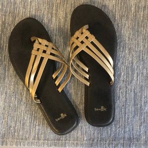 Gold sanuk flip flops